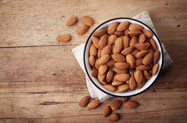 Bow Filled With Low-Carb Almonds on Wooden Table | Vitacost.com/blog