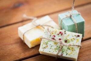 DIY Herbal Soaps Tied with Twine on Wooden Table | Vitacost.co/blog