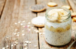 Banana-Topped Overnight Oatmeal in Jar on Wooden Table | Vitacost.com/blog