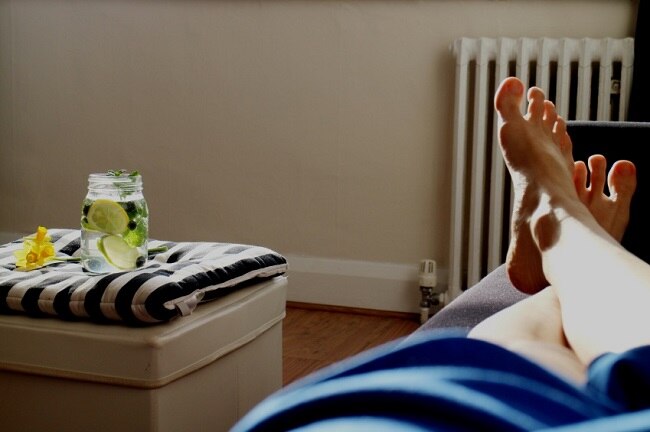 Person taking a rest day with feet up and lemon water #restday #nutrition www.vitacost.com/blog