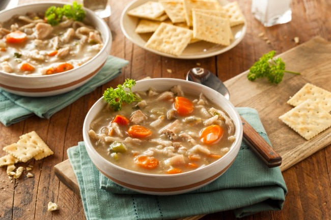 Homemade crockpot chicken soup bowls with crackers