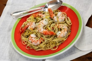 Shrimp fettuccine on a red plate