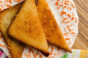 Toast with Garlic and Honey on White-and-Orange Plate