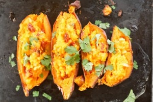 Baked sweet potatoes on baking sheet www.vitacost.com/blog