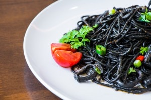 Black bean spaghetti pasta on a white plate www.vitacost.com/blog