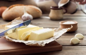 Knife Slicing Through Sticks of Butter www.vitacost.com/blog