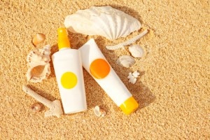 Sunscreen and shells on sand #naturalsunscreen www.vitacost.com/blog