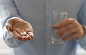 Taking a Men's Multivitamin With Glass of Water www.vitacost.com/blog