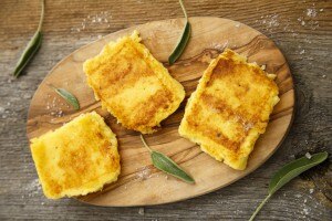 Grilled polenta on a wooden board blog,vitacost.com