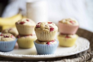Strawberry-banana protein muffins stacked on white plate #healthy #recipe | www.vitacost.com/blog