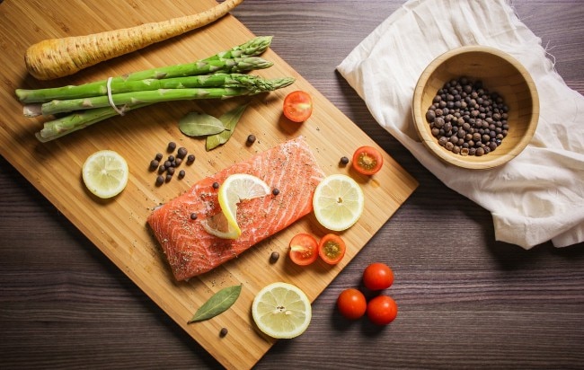 Paleo Diet Staples: Salmon and Vegetables on Cutting Board www.vitacost.com/blog