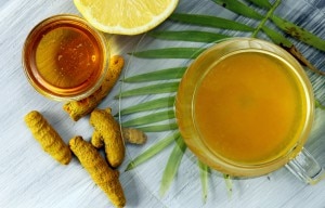 Turmeric Tea with Honey and Lemon on a Wooden Table | www.vitacost.com/blog