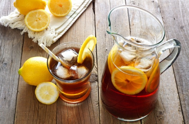 Pitcher & Glass of Homemade Iced Tea With Lemon on Wooden Table | Blog.Vitaocost.com