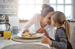 Busy Mom Enjoying Pancake Breakfast With Daughter | www.vitacost.com/blog