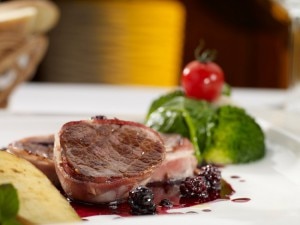 Blackberry marinade over steak on white plate #recipe | www.vitacost.com/blog