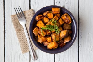 Sweet potato hash on white wood background #sidedishes www.vitacost.com/blog