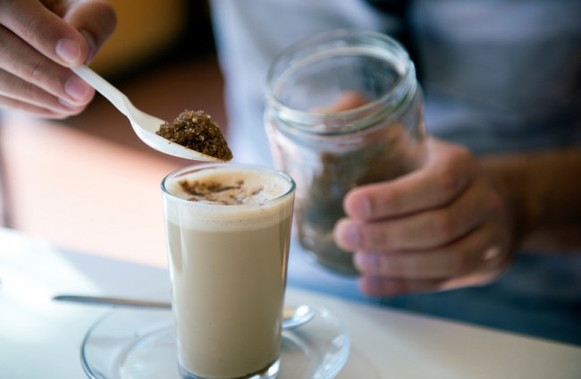 Spooning Mocha Powder into Mug for Flavored Coffee | www.vitacost.com/blog