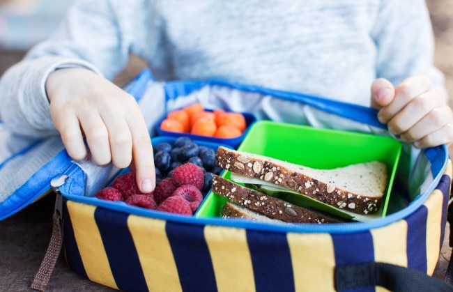 Child Eating Lunch Packed in Eco-Friendly Container | Vitacost.com/blog