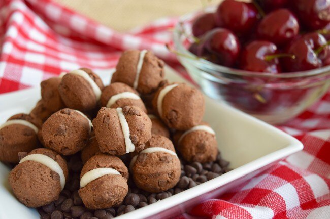 Mini Chocolate Cookie Sandwiches with Black Cherry Frosting On a Plate | www.vitacost.com/blog