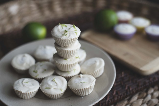Mini Coconut Cream & Lime Protein Pies Mini coconut lime protein pies stacked on white place | www.vitacost.com/blog