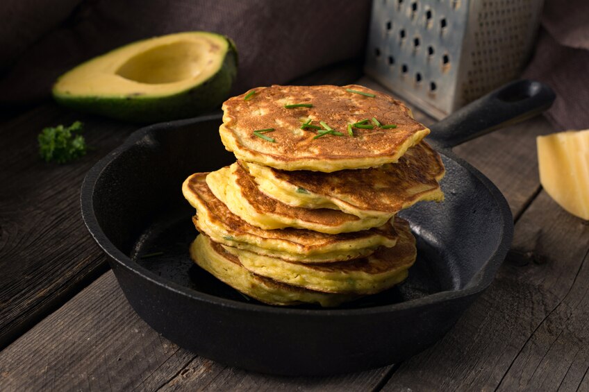 Gluten-Free Poppy Seed & Onion Pancakes Gluten-Free Poppy Seed and Onion Pancakes Stacked on a Cast Iron Skillet with Herbs | www.vitacost.com/blog