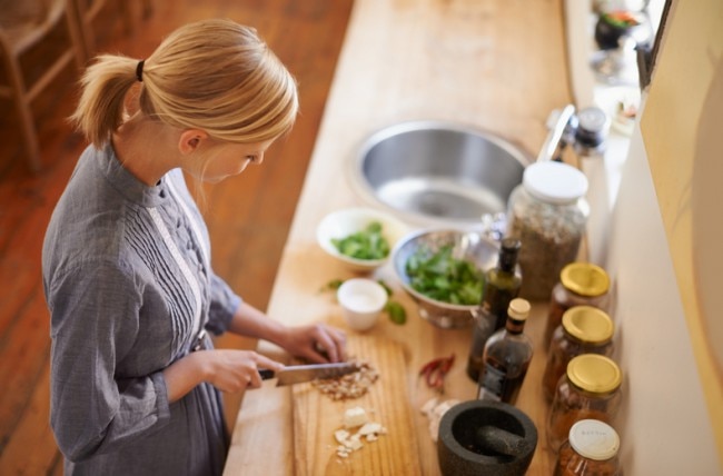 Woman Trying Healthy Food Swaps Chopping Vegetables | www.vitacost.com/blog