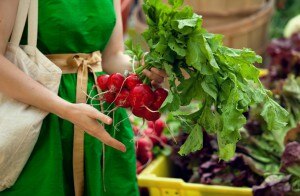 Woman Shopping at Farmers Market Holding Vegetables | www.vitacost.com/blog