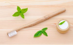 Natural Toothpaste Powder With Bamboo Brush on Wooden Table | Vitacost.com/blog
