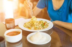 Woman Eating Comfort Food Bowl of Spaghetti | Vitacost.com/blog