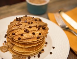 Stack of Gluten-Free Pancakes with Sunflower Seed Butter and Chocolate Chips #recipe | Vitacost.com/blog