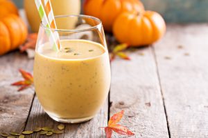 Pumpkin Pie Smoothie on Seasonal Table with Pumpkins and Fall Leaves | Vitacost.com/Blog