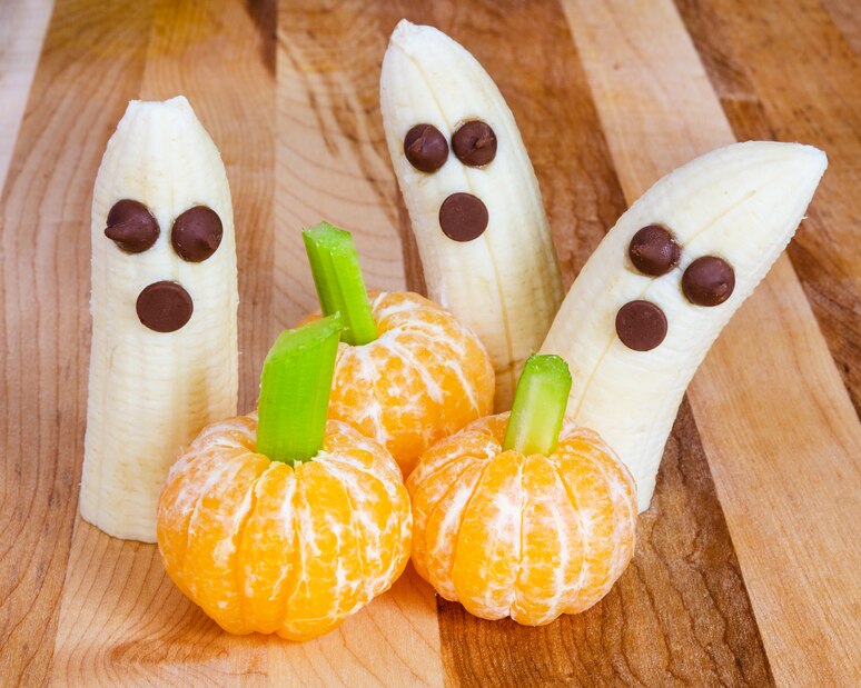 5 Healthy Halloween Appetizer & Snack Ideas  bananas and clementines made to look like pumpkins and ghosts | Vitacost.com/Blog