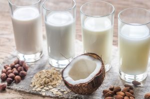 Glasses of Non-Dairy Milk Alternatives in a Row | Vitacost.com/blog