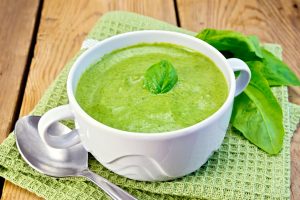 Soup with pumpkin, hemp and spinach in white bowl | Vitacost.com/blog