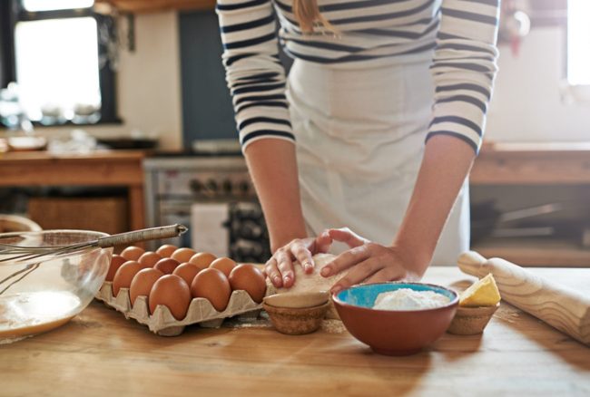 Woman in Apron Baking Holiday Recipes With Healthy Food Swaps | Vitacost.om/blog