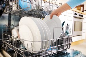 Loading Dishwasher to Clean Up After a Holiday Party | Vitacost.com/blog