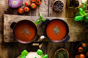 Herb & tomato soup in bowls on wood | Vitacost.com/blog