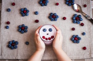Child Reaping the Benefits of Probiotics With Berry-Topped Yogurt | Vitacost.com/blog