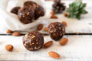 Snack balls made with peanut butter, chocolate chips and almonds #peanutbutterballs | Vitacost.com/blog