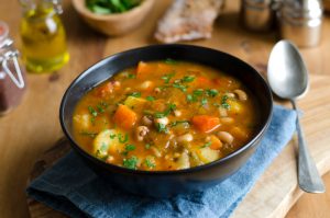 Bowl of chicken curry soup with whole grains & beans | Vitacost.com/blog
