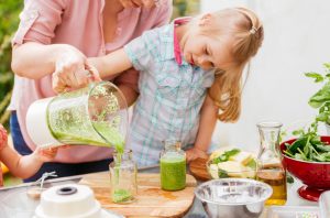 Mother and Daughter Making Green Smoothie as Part of Sugar Detox Plan | Vitacost.com/blog