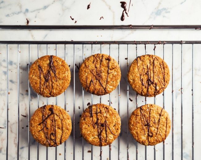 Lemon Coconut Sunflower Cookies with chocolate icing on cooling rack | Vitacost.com/blog