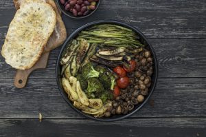 Roasted vegetables in black pan on wood #recipe | Vitacost.com/blog