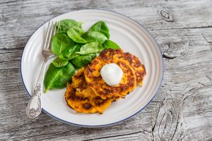 Hemp & Squash Cakes on plate with spinach | Vitacost.com/blog