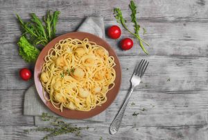 Cauliflower fettuccine on brown plate #cauliflowerpasta | Vitacost.com/blog