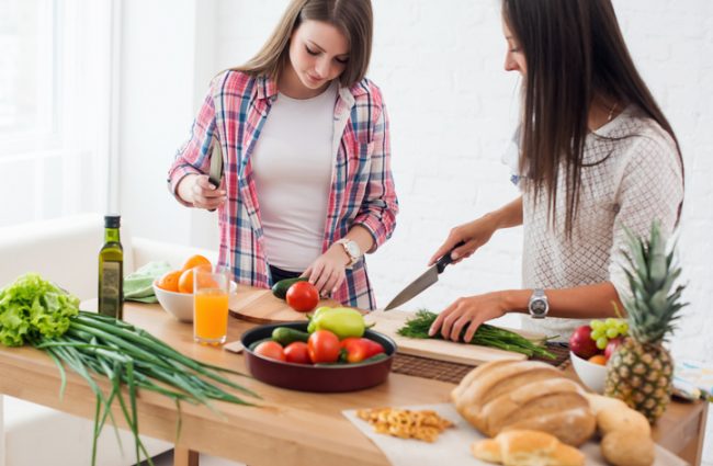 Two Women Following Flexitarian Diet Chopping Vegetables | Vitacost.com/blog