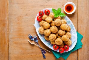 Baked Cauliflower Poppers on a white plate #vegetarianmeatballs | Vitacost.com/blog