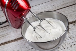 Hand mixer blending homemade dairy-free whipped cream | Vitacost.com/Blog