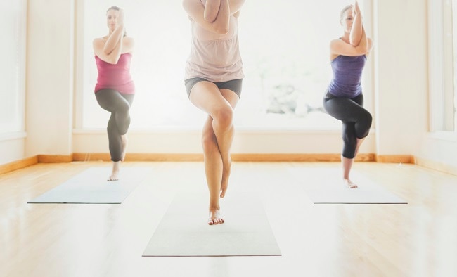 Three Women Doing Yoga Champion Workplace Wellness | Vitacost.com/blog