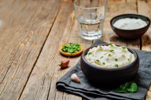 Steamed Cauliflower Mash in Bowl Garnished with Parsley | Vitacost.com/Blog